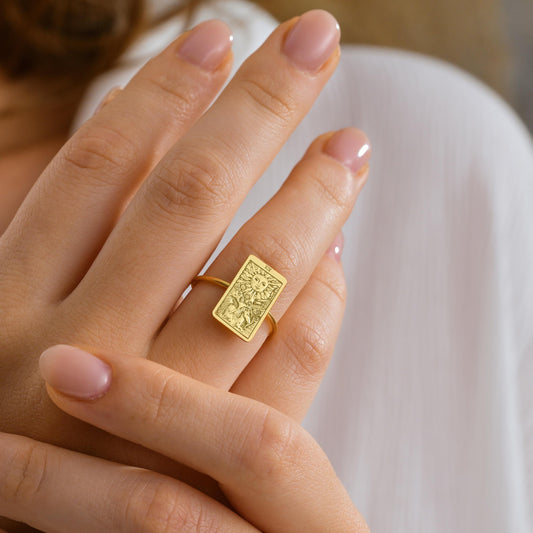 Tarot card signet ring worn on finger