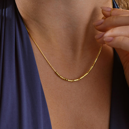 Morse code necklace shown from the side