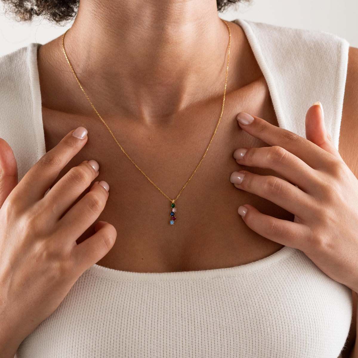 Vertical stone necklace shown in several colours