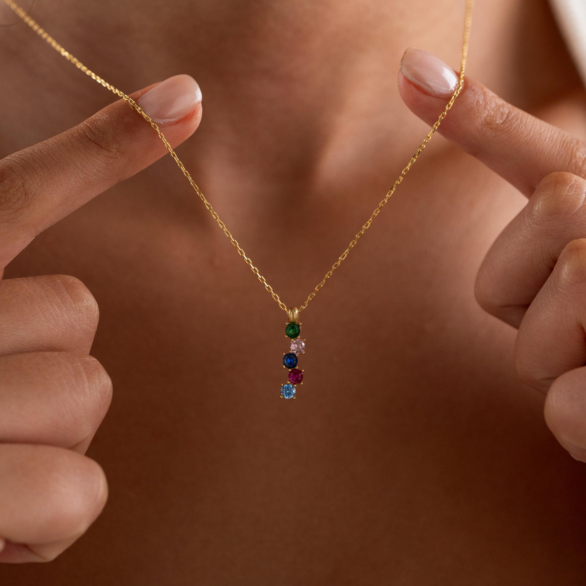 Personalized family birthstone necklace styled as a gift
