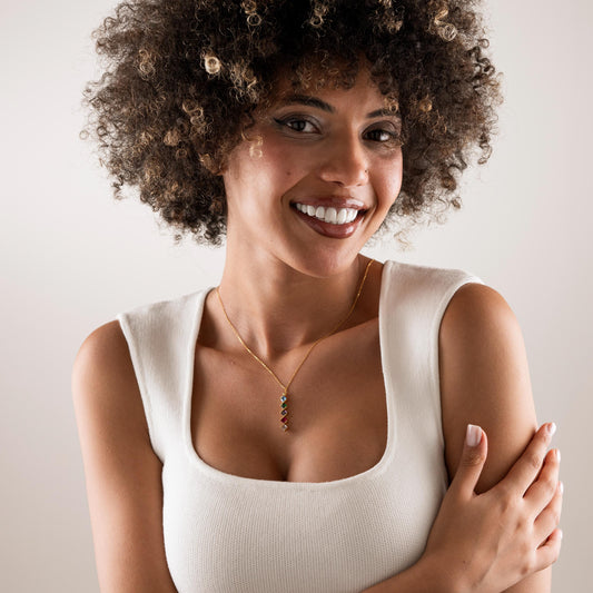 Square birthstone necklace worn on the neck