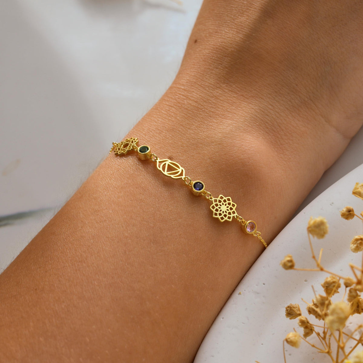 Chakra stone bracelet detail showing the colour order