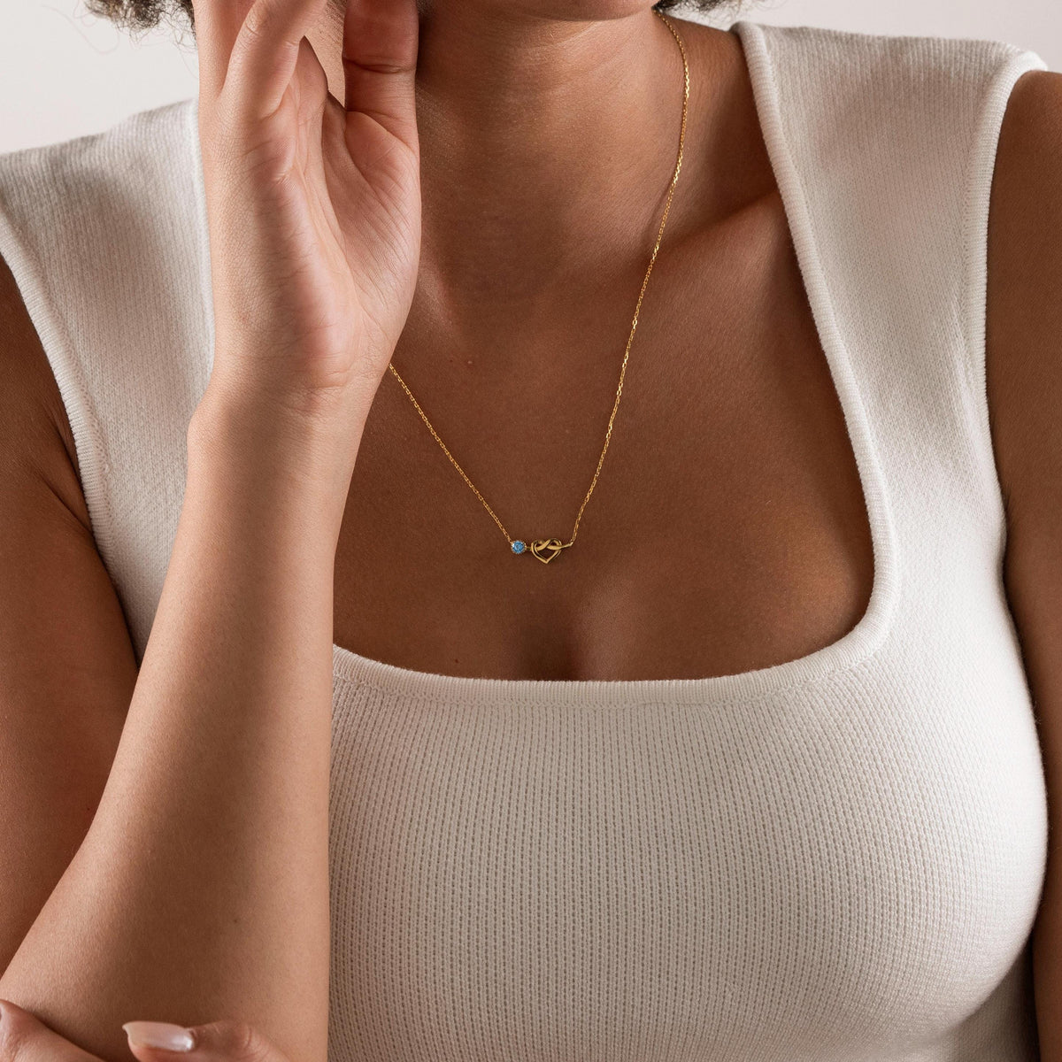 Heart birthstone necklace worn on the neck