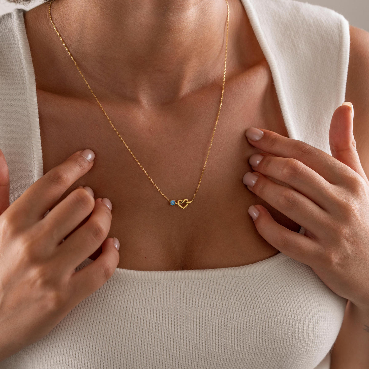 Personalized heart birthstone necklace styled as a gift