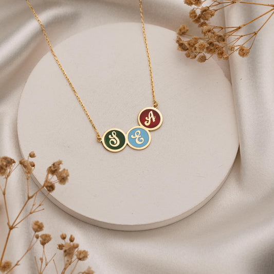 Enamel filled letter pendant detail
