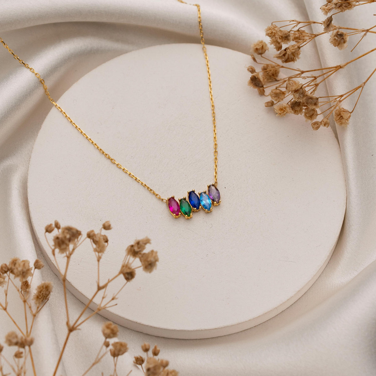 Custom marquise birthstone necklace styled as a gift