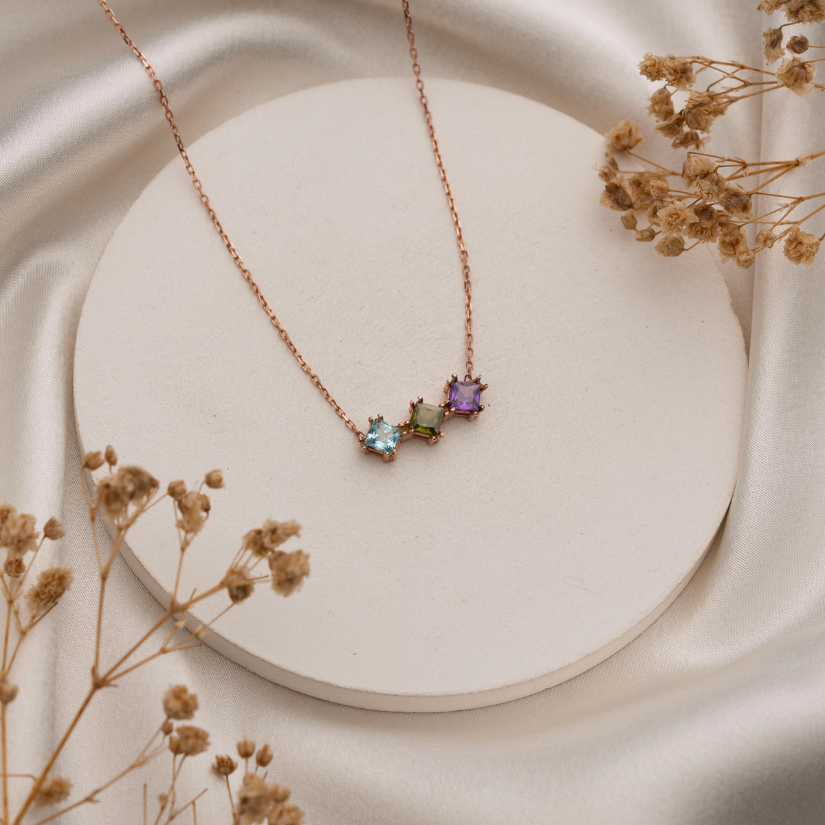 Overlapping family birthstone pendant detail