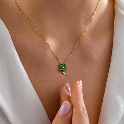 Four leaf clover birthstone necklace worn on the neck