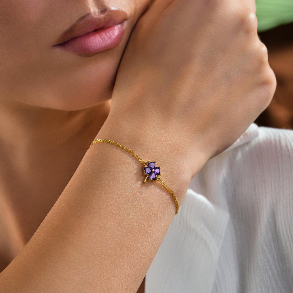 Flower birthstone bracelet worn on the wrist