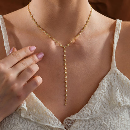 Y drop necklace styled with an open neckline