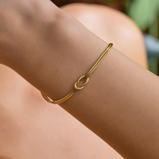 Knot bangle bracelet worn on the wrist
