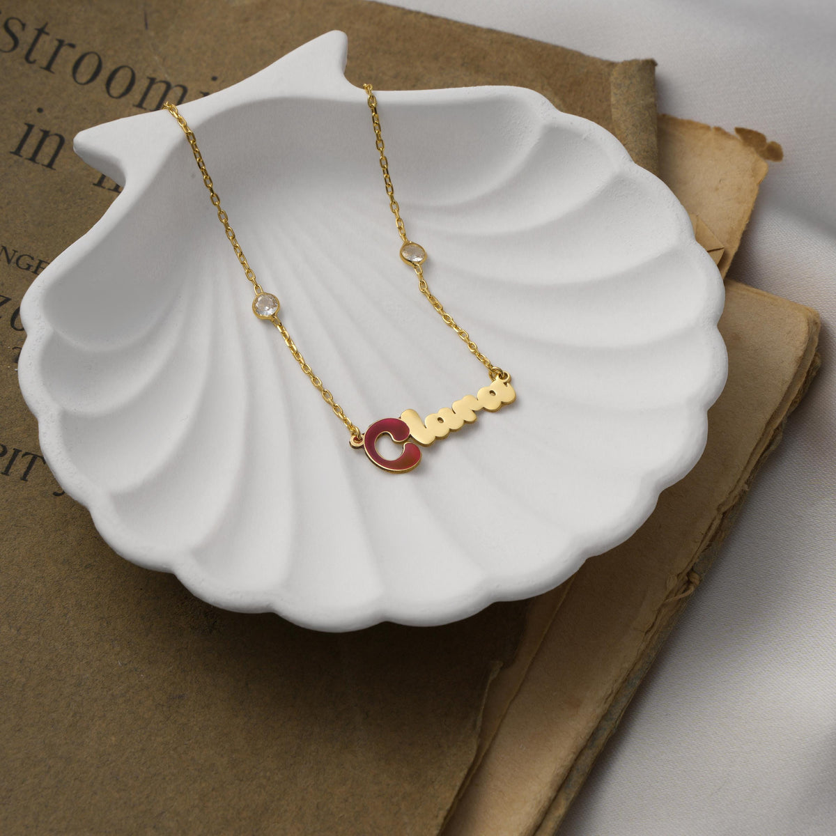 Personalized enamel initial necklace shown in a gift box