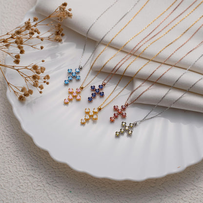 Dainty cross pendant set with coloured stones