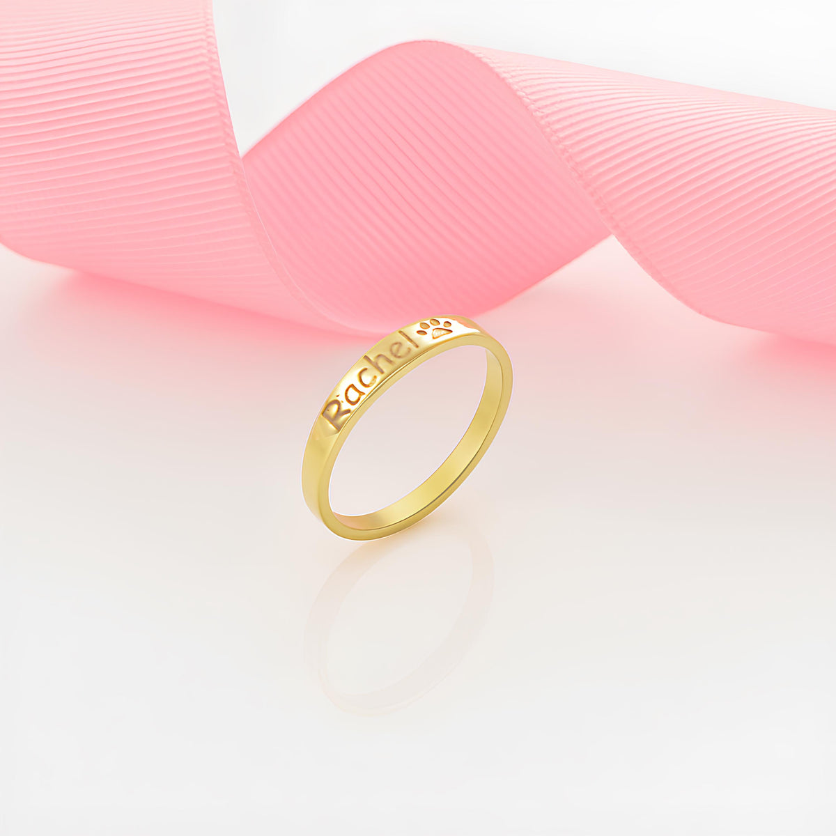Name ring detail showing the engraved script