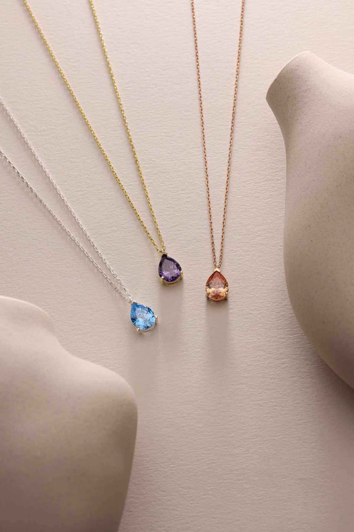 Teardrop gemstone necklaces in several stone colours