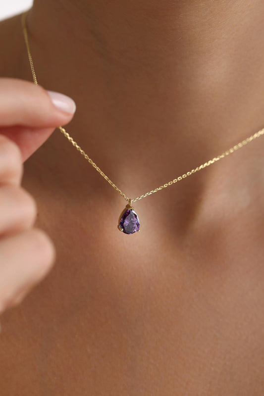 Amethyst teardrop necklace in gold worn on the neck