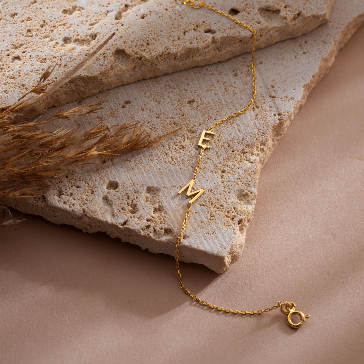 Initial letter bracelet in gold plated finish