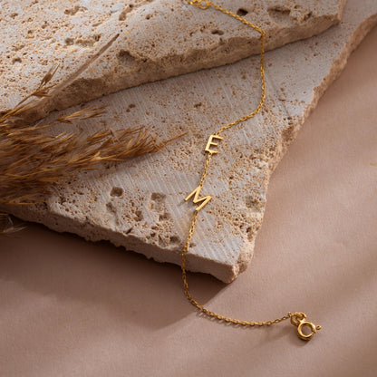 Initial letter bracelet in gold plated finish