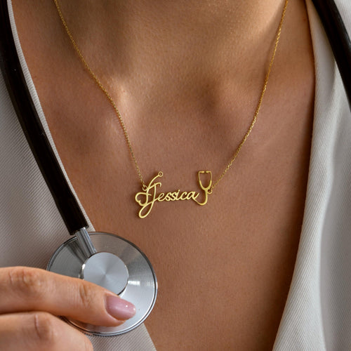 Stethoscope name necklace held up by a woman