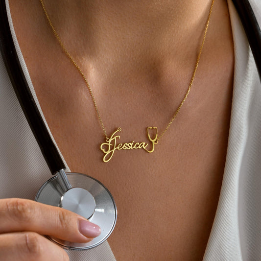 Stethoscope name necklace held up by a woman
