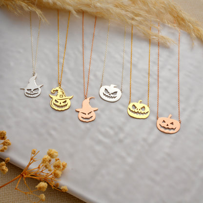 Ghost and pumpkin necklaces in different finishes