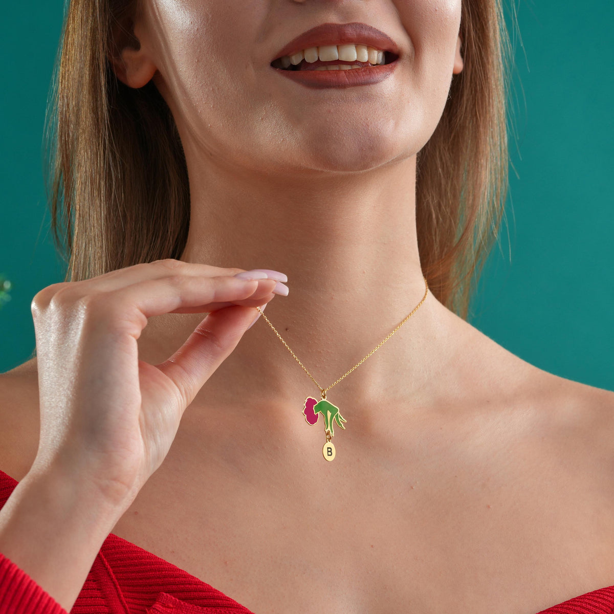 Flower initial necklace worn on the neck