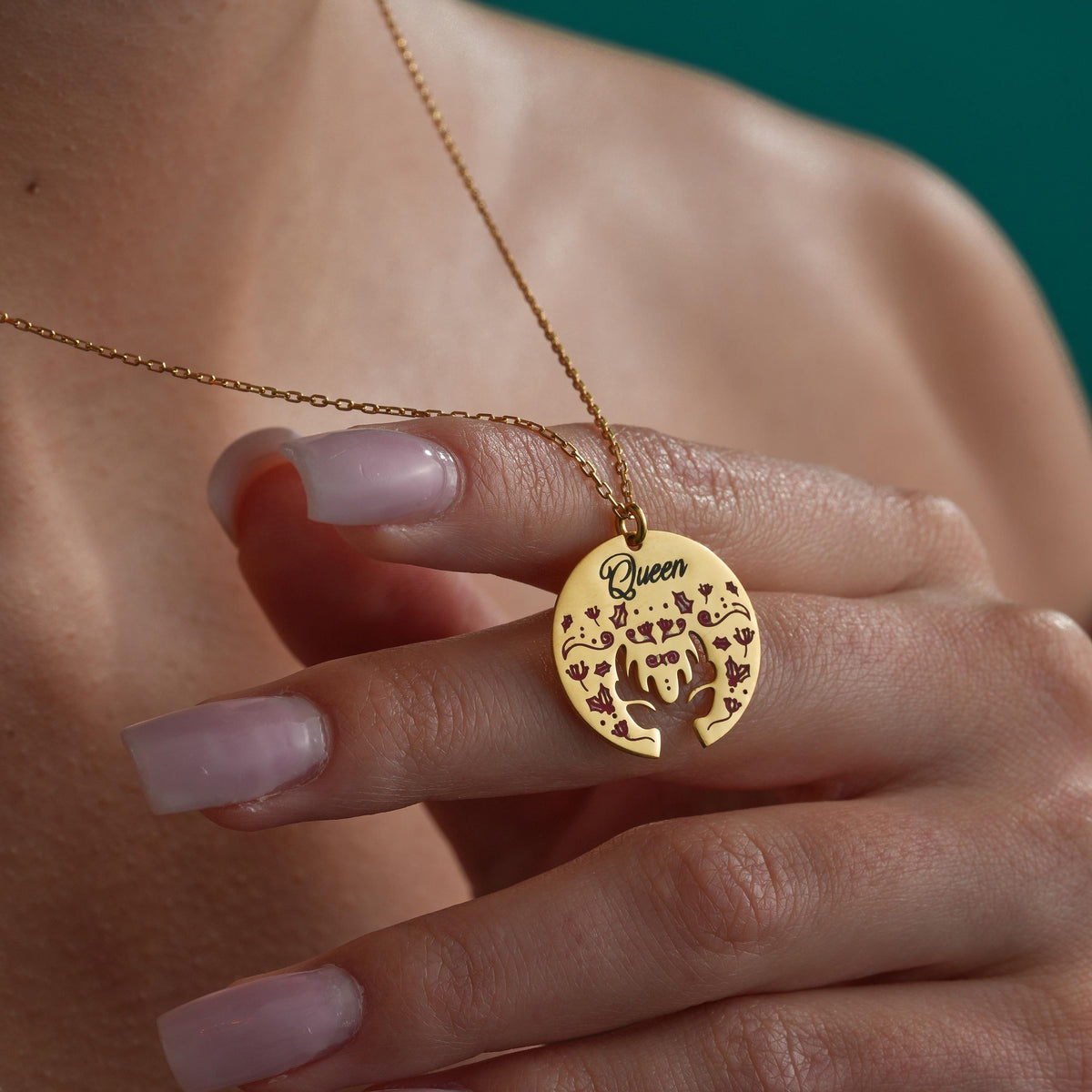 Personalized reindeer medallion necklace worn by a woman