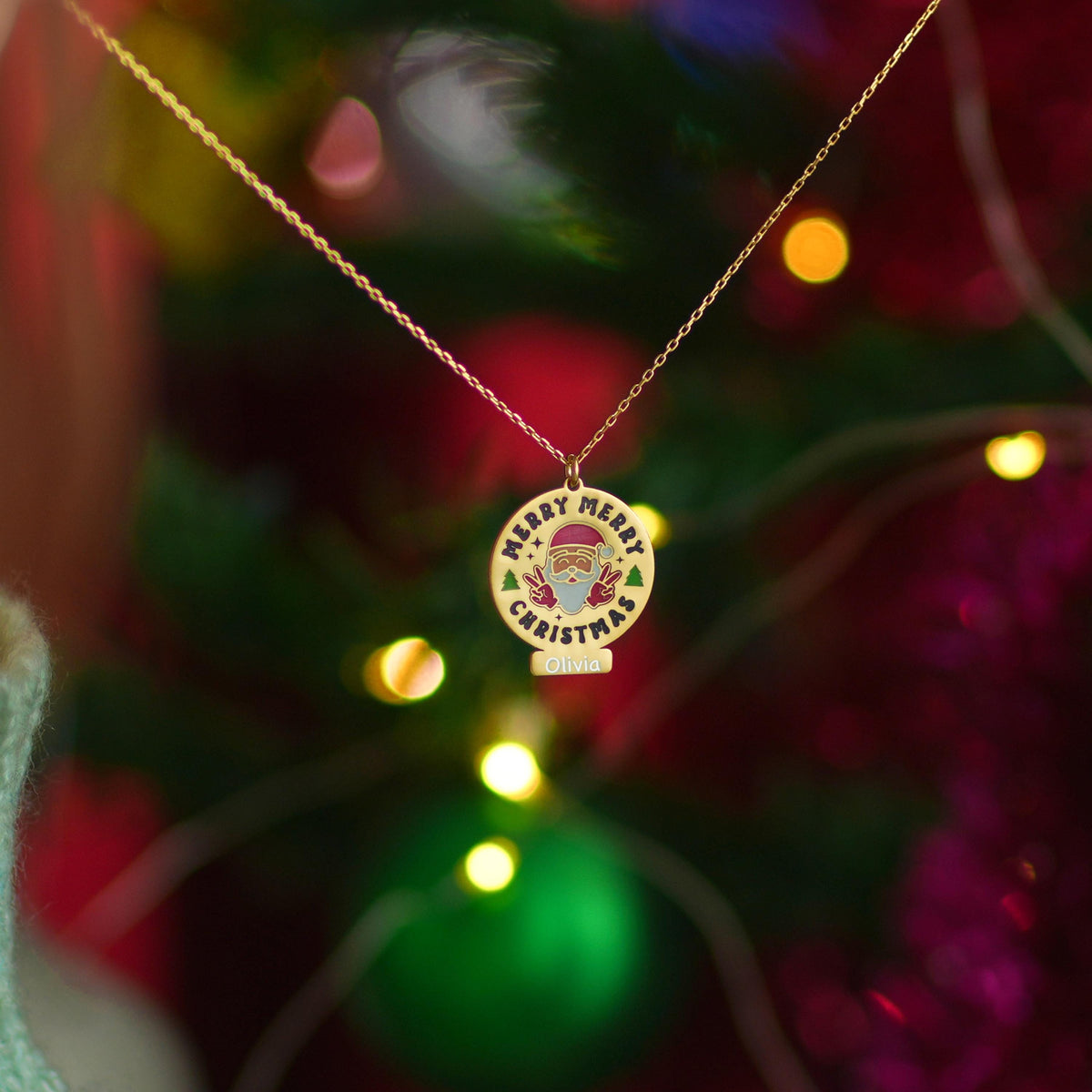 Merry Christmas medallion necklace shown against a festive background