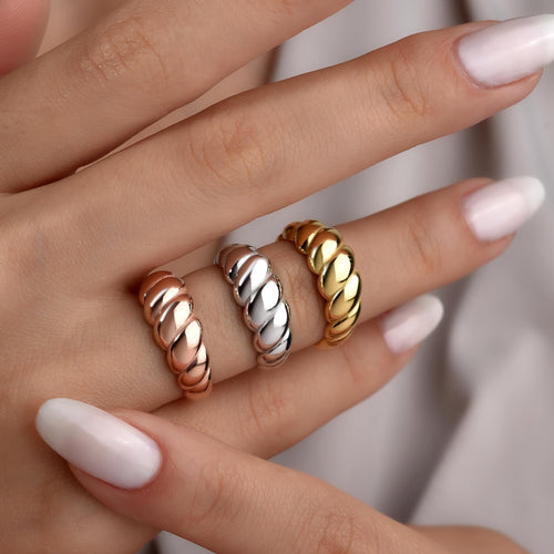 Croissant dome rings worn in gold, silver and rose gold