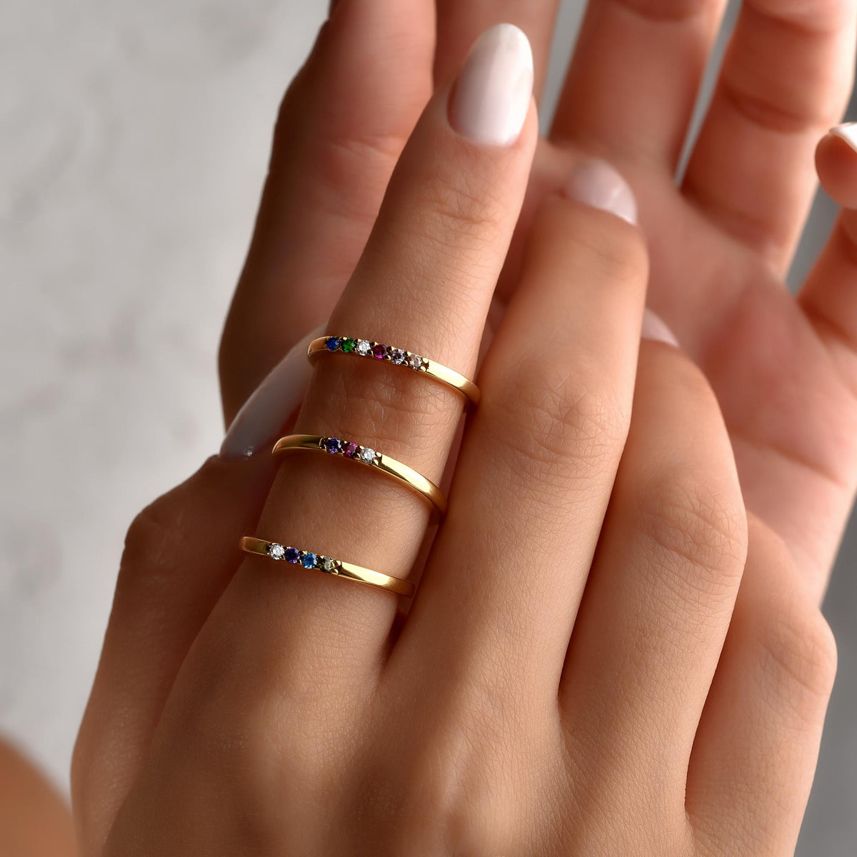 Personalized birthstone band stacked with another ring
