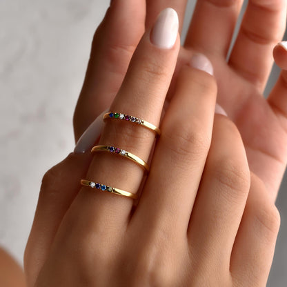 Personalized birthstone band stacked with another ring
