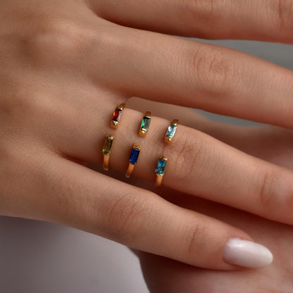 Duo baguette birthstone rings worn on the hand