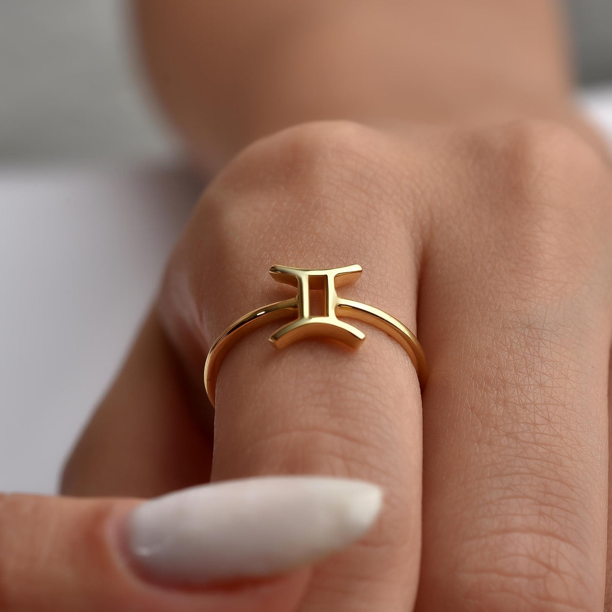 Zodiac sign ring worn on the hand