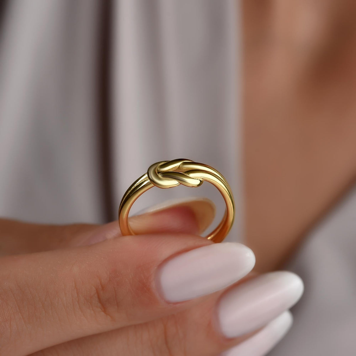 Nautical knot ring detail on the finger