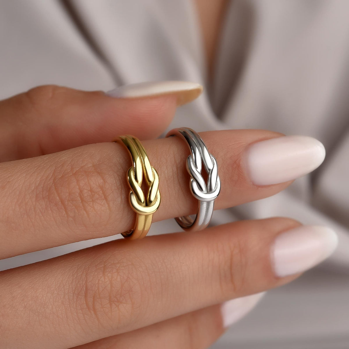 Sailor knot rings worn in gold and silver