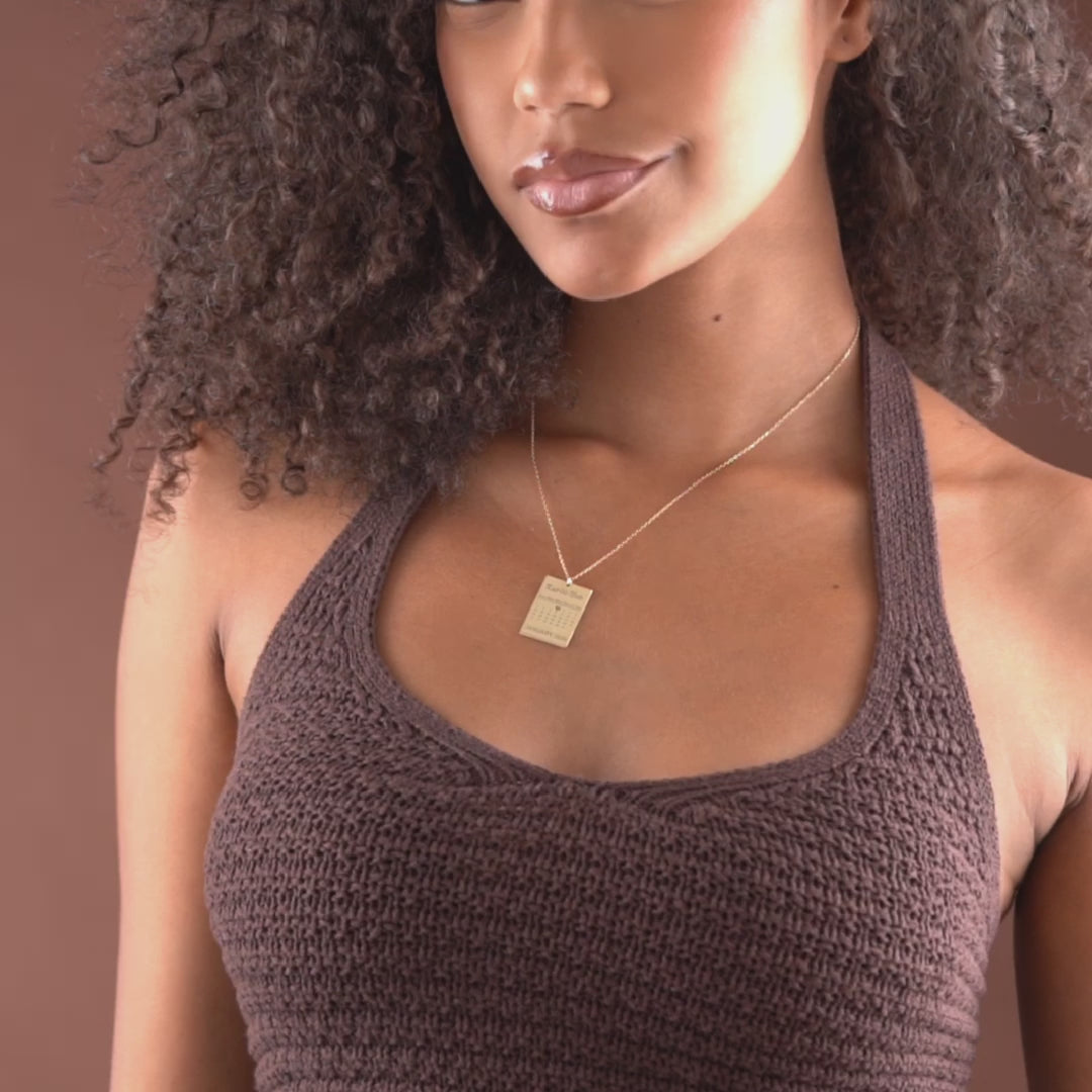 Video showing personalized calendar necklace engraving details