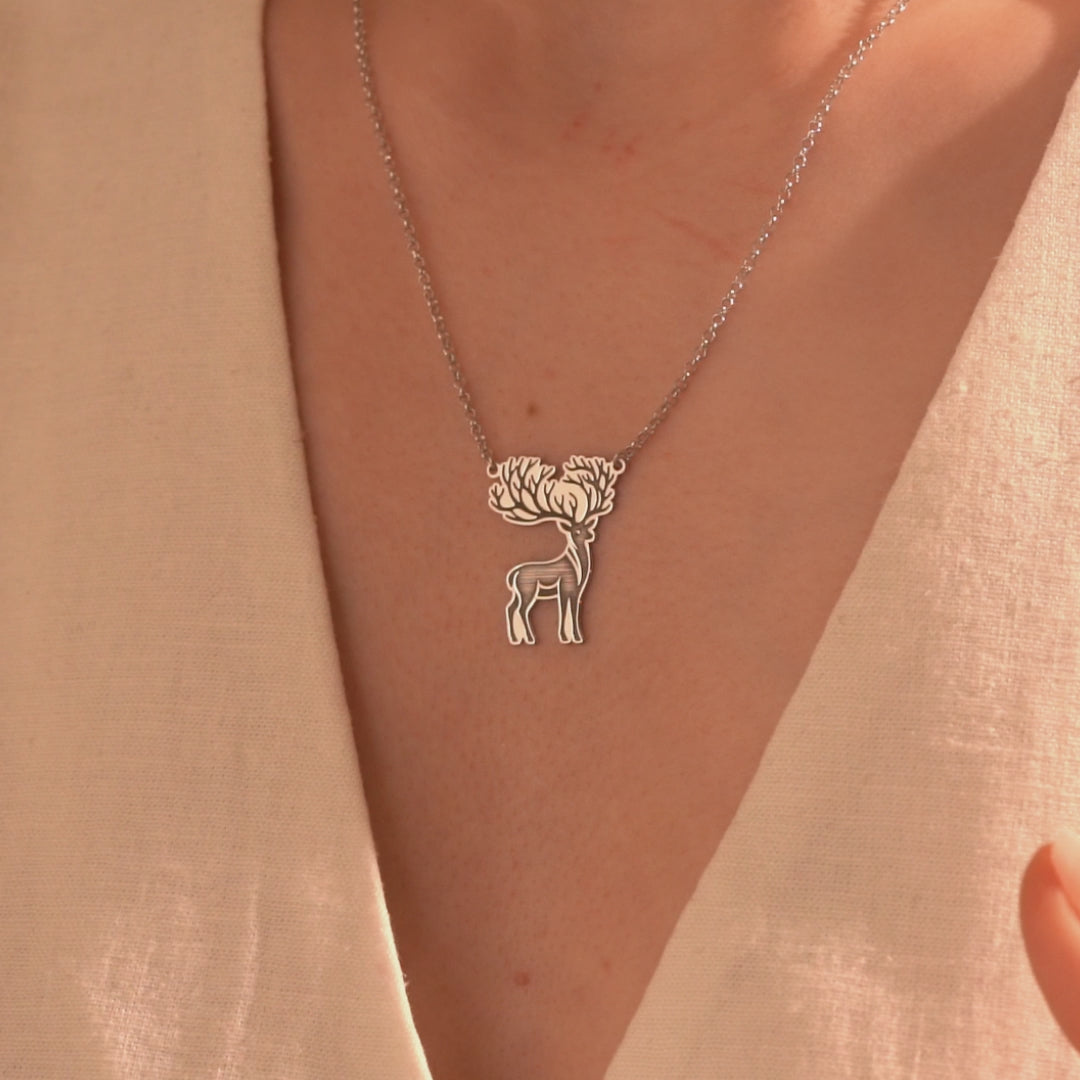 Nature-inspired silver deer and antler pendant necklace
