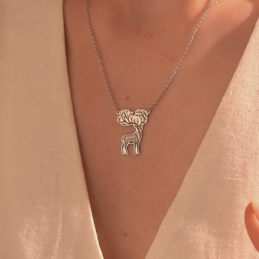 Nature-inspired silver deer and antler pendant necklace
