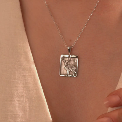 Silver deer necklace with rectangular open frame