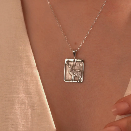 Silver deer necklace with rectangular open frame