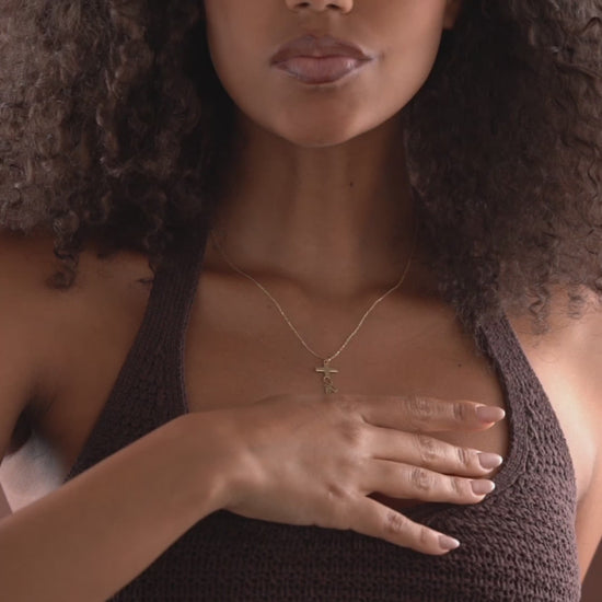 Video showing personalized cross and script name pendant