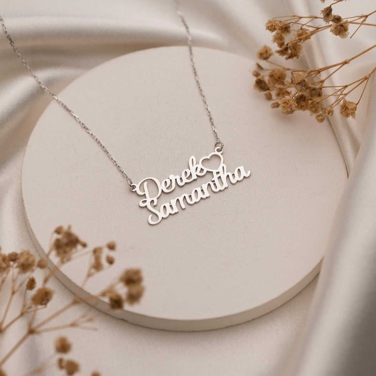 Close-up of custom two name script necklace